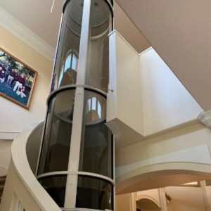 Spiral staircase with cylindrical elevator