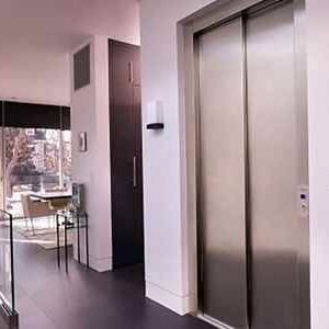 Stylish interior with elevator and sunlight