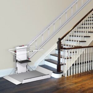 Stairlift beside a wooden staircase