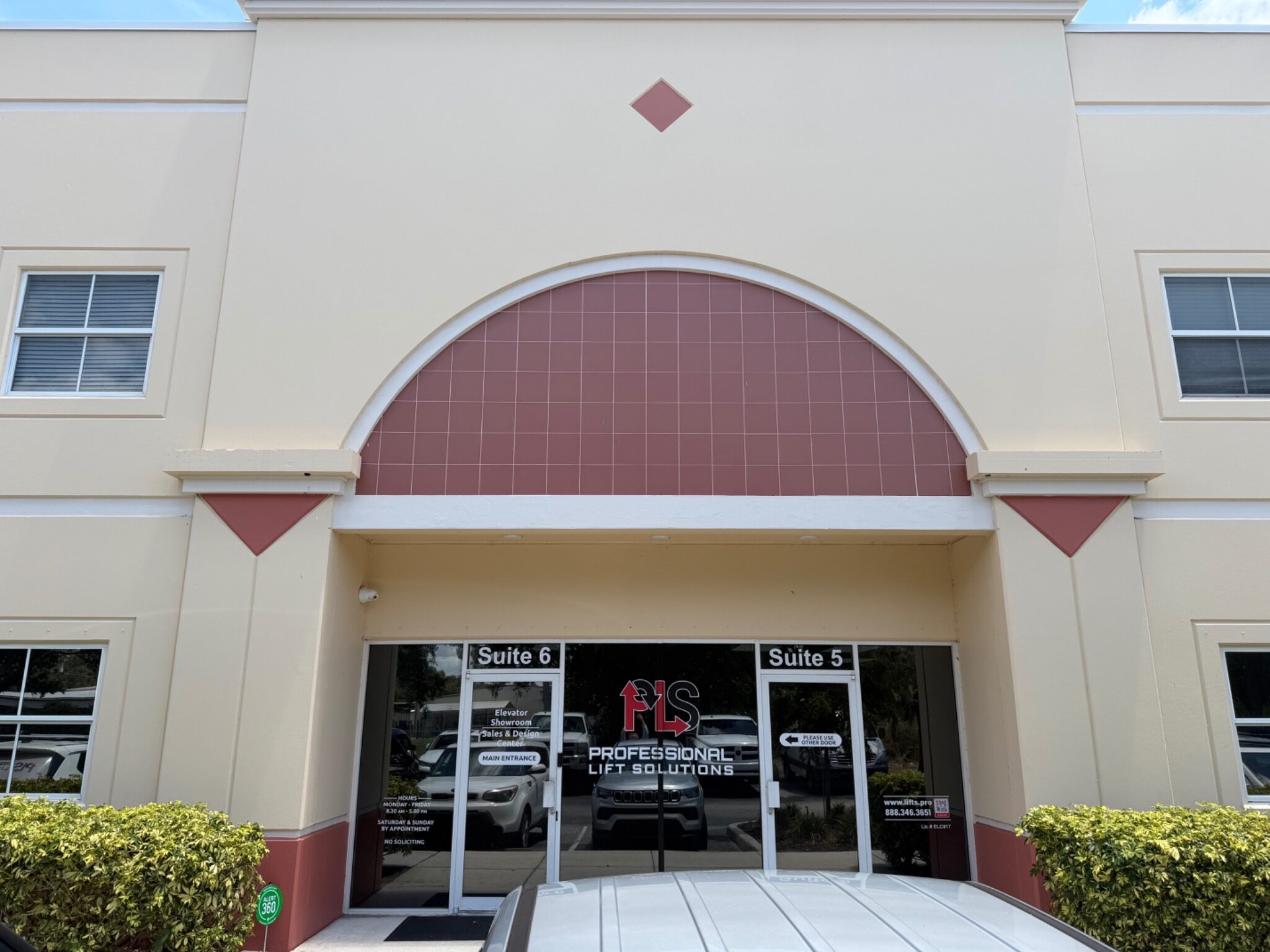 Office building entrance with arched red tile