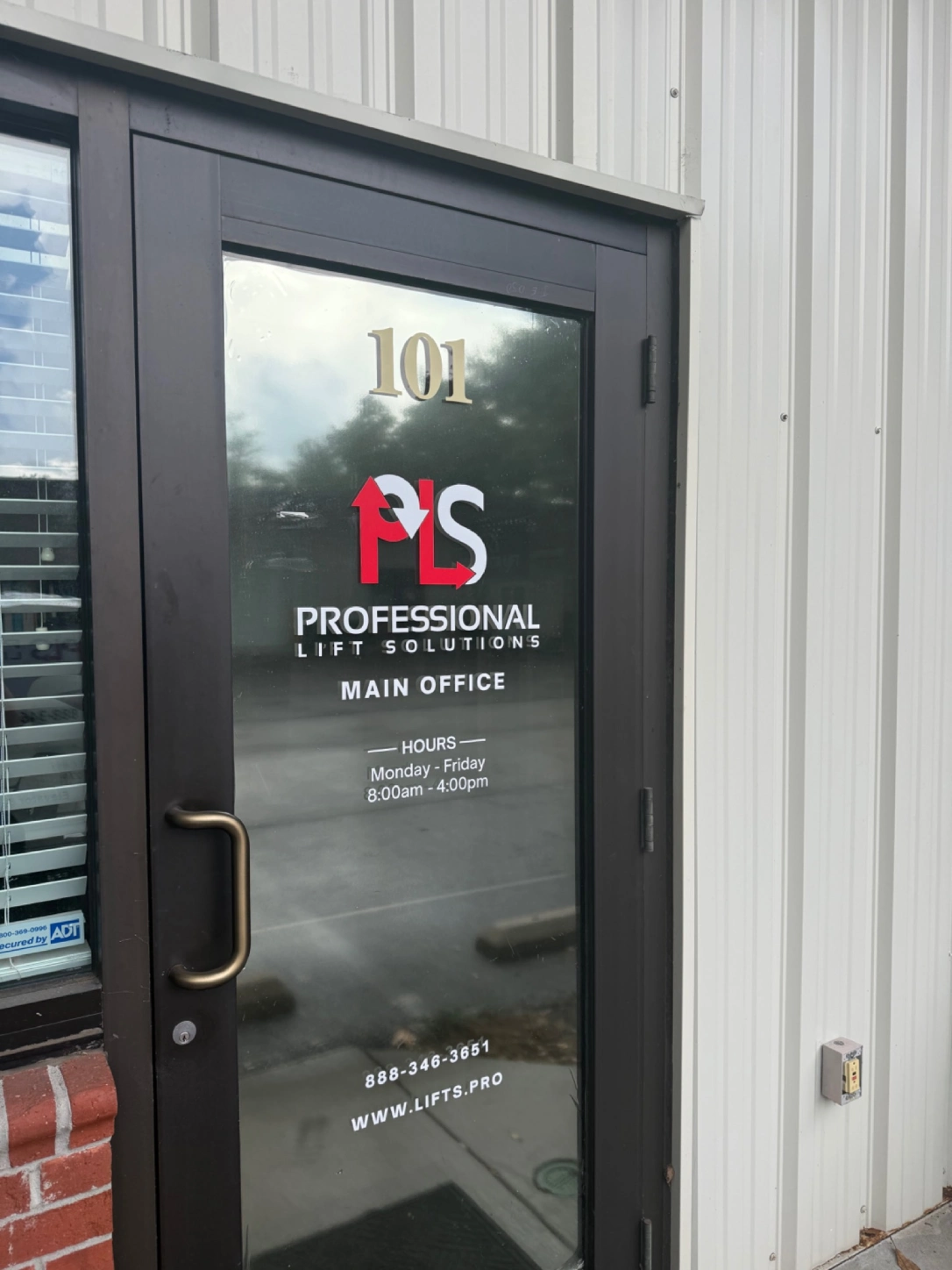 Professional Lift Solutions main office glass door
