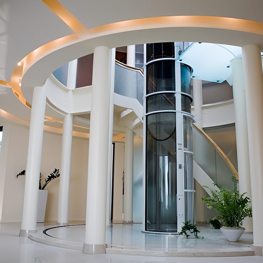 Modern atrium lobby with glass elevator